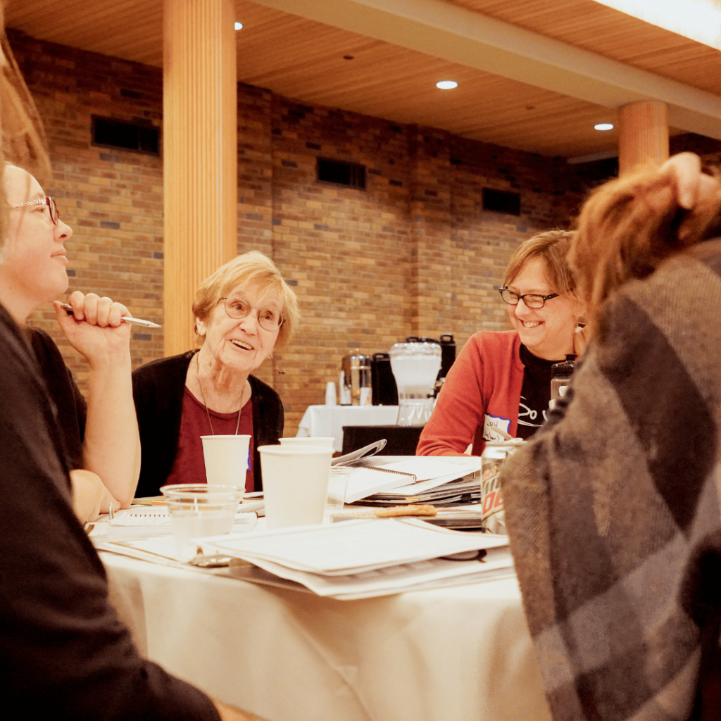 A table deep in conversation with smiles on their faces